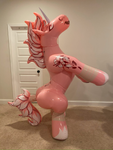 Pink inflatable unicorn suit